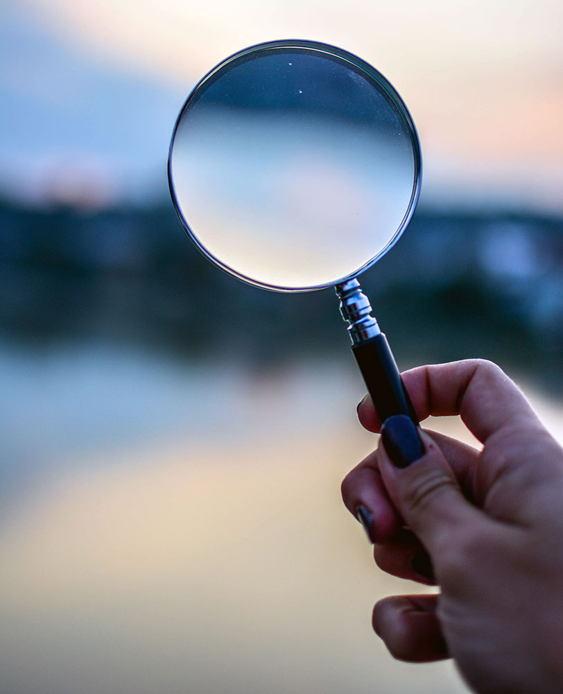 A Woman Holding a Magnifying Glass in Vancouver, BC